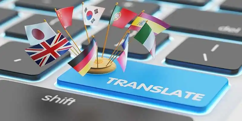 © Cybrain - stock.adobe.com | Foreign languages translation concept, online translator, macro view of computer keyboard with national flags of world countries on blue translate button