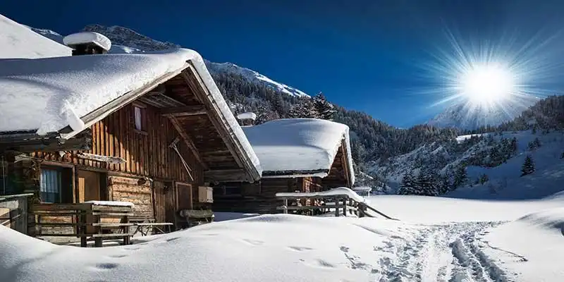 © Andreas Schindl - Fotolia | winter ski chalet and cabin in snow mountain landscape in tyrol