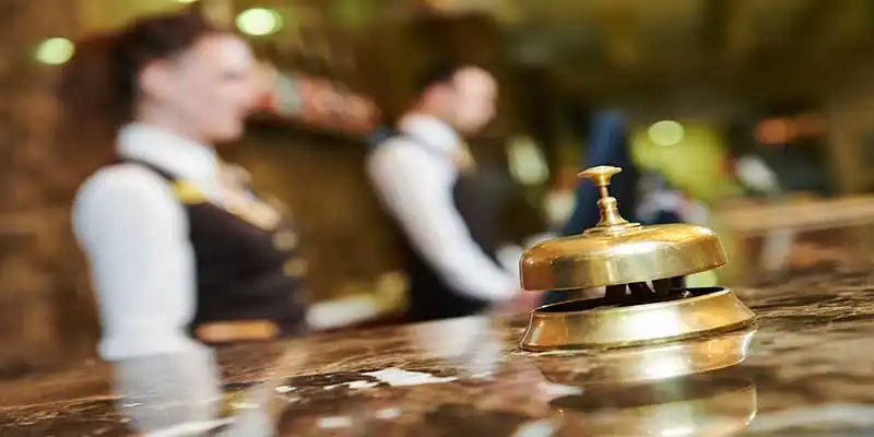 © Kadmy - Fotolia | Hotel reception with bell