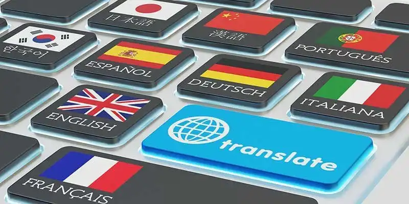 © Cybrain - stock.adobe.com | Foreign languages translation concept, online translator, macro view of computer keyboard with national flags of world countries on keys and blue translate button